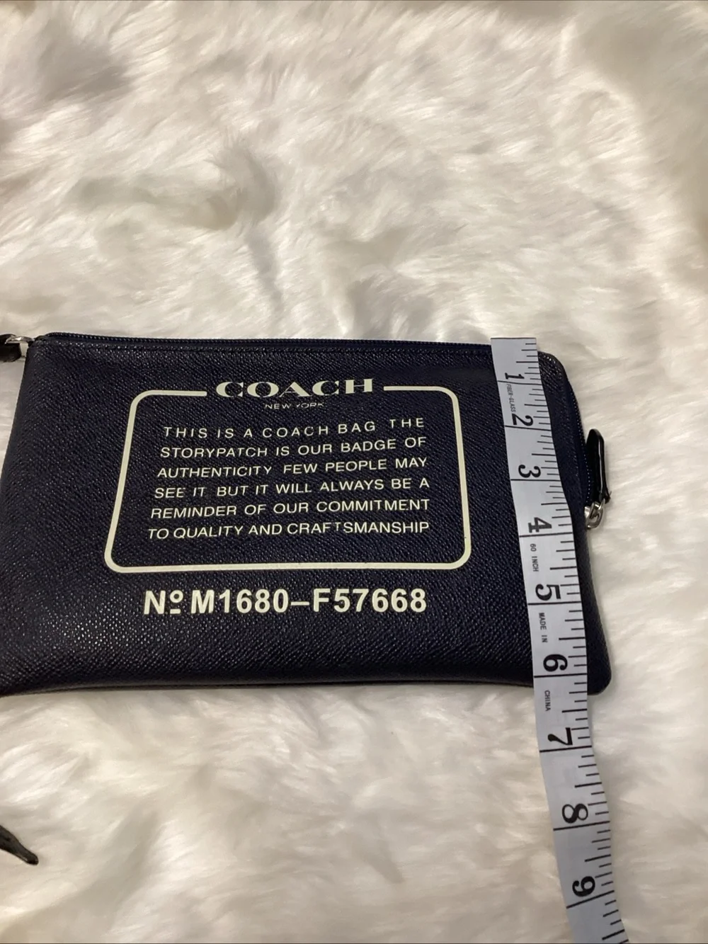Coach Navy Wristlet with Cream Logo Text